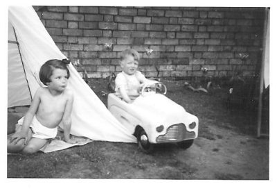 01 - in pedal car with Mary by tent - circa 1957-8.jpg