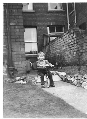 02 - on trike in back garden of 14 Seymour Av. - circa 1957-8.jpg