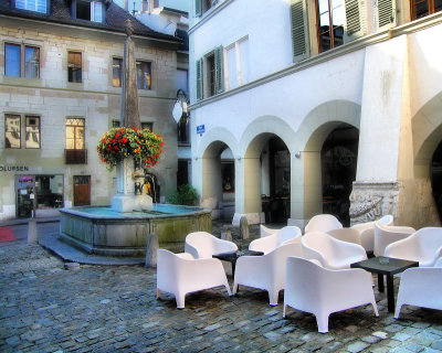Cobbled paving and armchairs...people will come