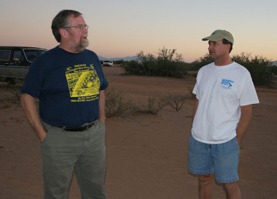 Dean Ketelsen and Sam Hershack with hands pocketed trying to avoid astronomer fish stories.