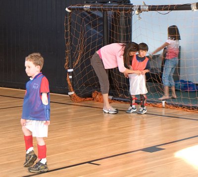 Firey Dragon #1 practices no-handed kick while goalie gets an underwear check.