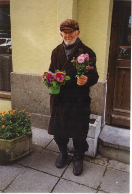 An old man selling flowers