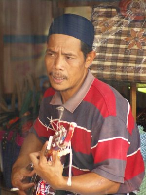 Singing & Strumming In The Rain