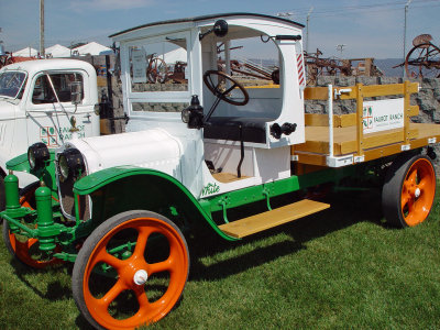 truck with the big orange wheel