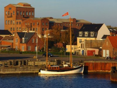 Boat in harbor at sunset