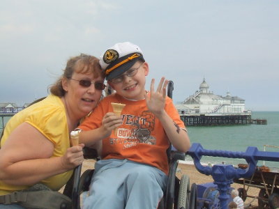 Ann and John,with Eastbourne pier ,behind.