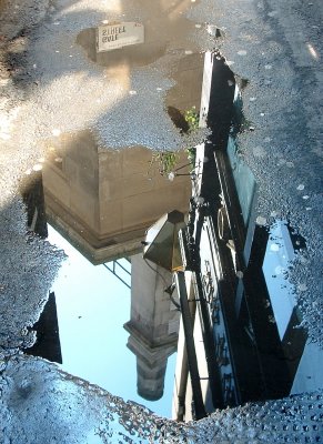 Puddle reflections in Gate Street,WC2