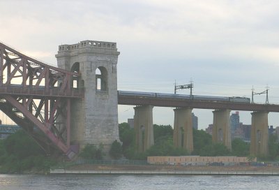 Amtrak train passing over the bridge