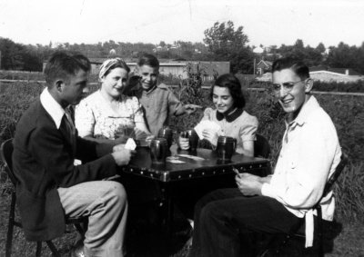 My father at the left of the photo in Sioux City, Iowa playing cards with his cousins. Taken around 1939. 