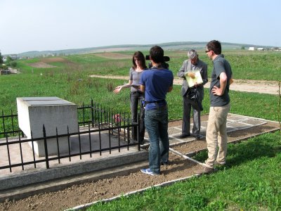 now we are at the southern mass grave, explaining what happened here for French TV
