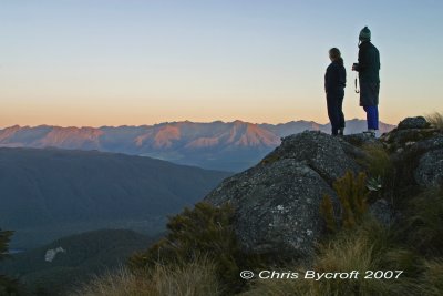 Fliss and Roy check sunset lighting on Takitmu Range