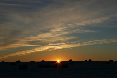 hay bales at sunset, saskatoon, canada