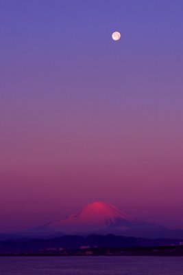 Moon set on red Mt. Fuji
