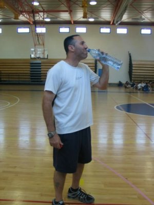 Coach Tomer drinking