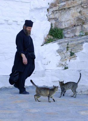 Monk and cats, amorgos is.