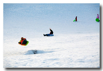 Then on the way home we find a hill where kids are having a great time sledding!