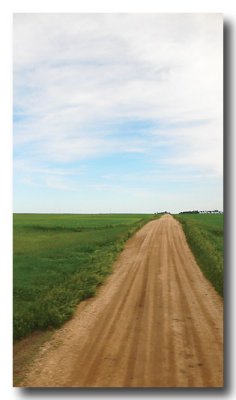 Through ND and Eastern Montana these farm roads stretch to the horizon through vast, flat land!