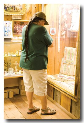 Mary Jane looks at displays at the mission....