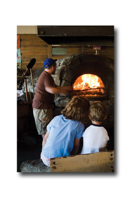 Then we stop for pizza where a couple of kids enjoy watching the cook working the beehive oven!