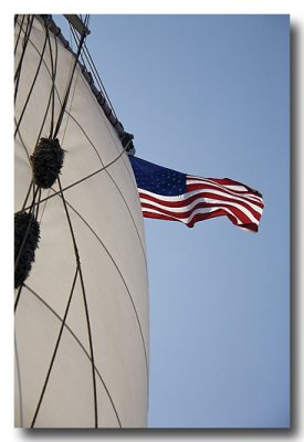 It's a breezy day, so the sails and flag billow!
