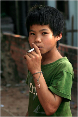 Kid smoking-Wat Ing village
