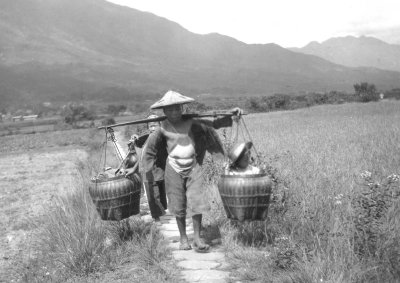 China 1906 Trans Boy carrying brother countryside