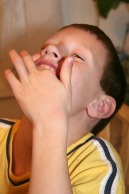 Isaac licking his fingers. Oh! I love that chocolate!!