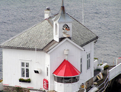 tiny house in middle of the fjord.JPG