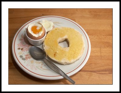 Soft boiled egg and toasted bagel