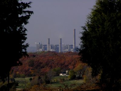 The power plant is about 5 miles away. The white brick house is about 1 mile.