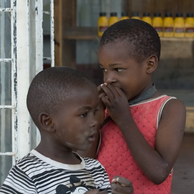 Boy and girl in front of gasstation