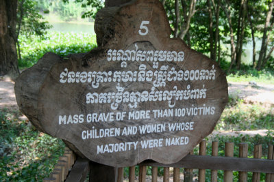 Sign indicating a mass grave of women and children.