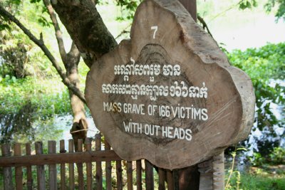 Sign indicating a mass grave of headless victims.