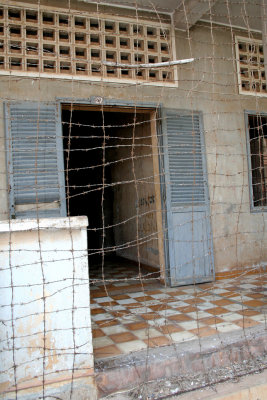 Barbed wire covering the entrance to some of the Tuol Sleng Prison cells.