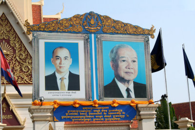 Close-up of billboard of the father and son kings.