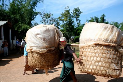 A Myanmar boy balancing a big load!