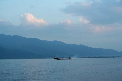 A speedboat was going by in the distance on Inle Lake.