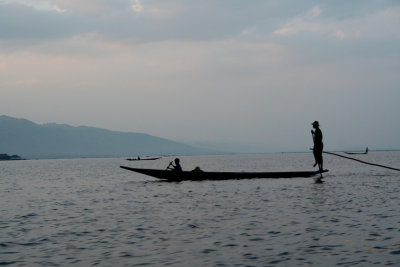 Seated rower in the stern, standing rower in the bow.