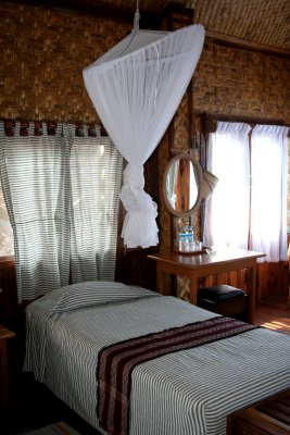 You can see the mosquito net and the parchment walls of the room.