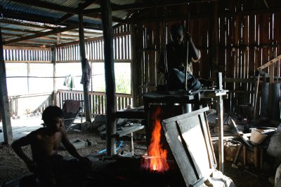 This is a local Inle Lake blacksmith shop.