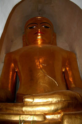 Closeup of another Buddha inside the Manuha Temple.  Notice the clasped hands in the foreground.