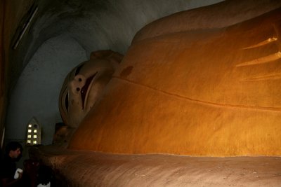 There is a huge (90 ft. long) Reclining Buddha in a very cramped chamber in the back of the Manuha Temple.