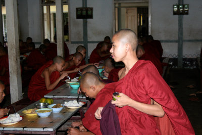 A procession of 1,000 monks go to take their final meal of the day at noon.