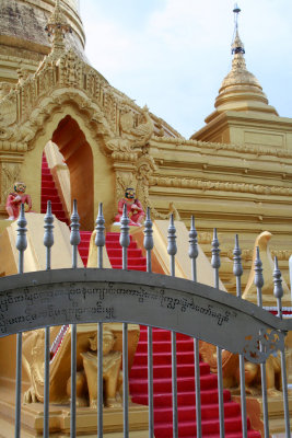 Nice gate, sculptures and stairs at the stupa of Kuthodaw Pagoda.