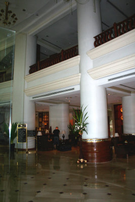 Interior of the hotel with the front desk in the background.