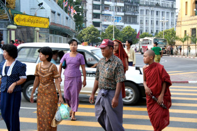 Every day people crossing the street outside of the Sule Pagoda.