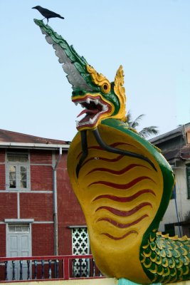 Closeup of the dragon sculpture.  The pigeon on top does not seem to be phased by the dragon!