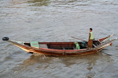 There are also small boats on the Yangon River.