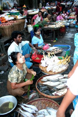 Fish and poultry vendors in Yangon's Chinatown section.