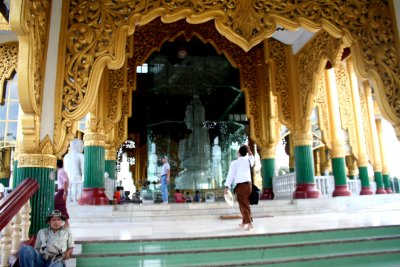 The pathway leads to a large white marble Buddha image carved from a single block of stone.